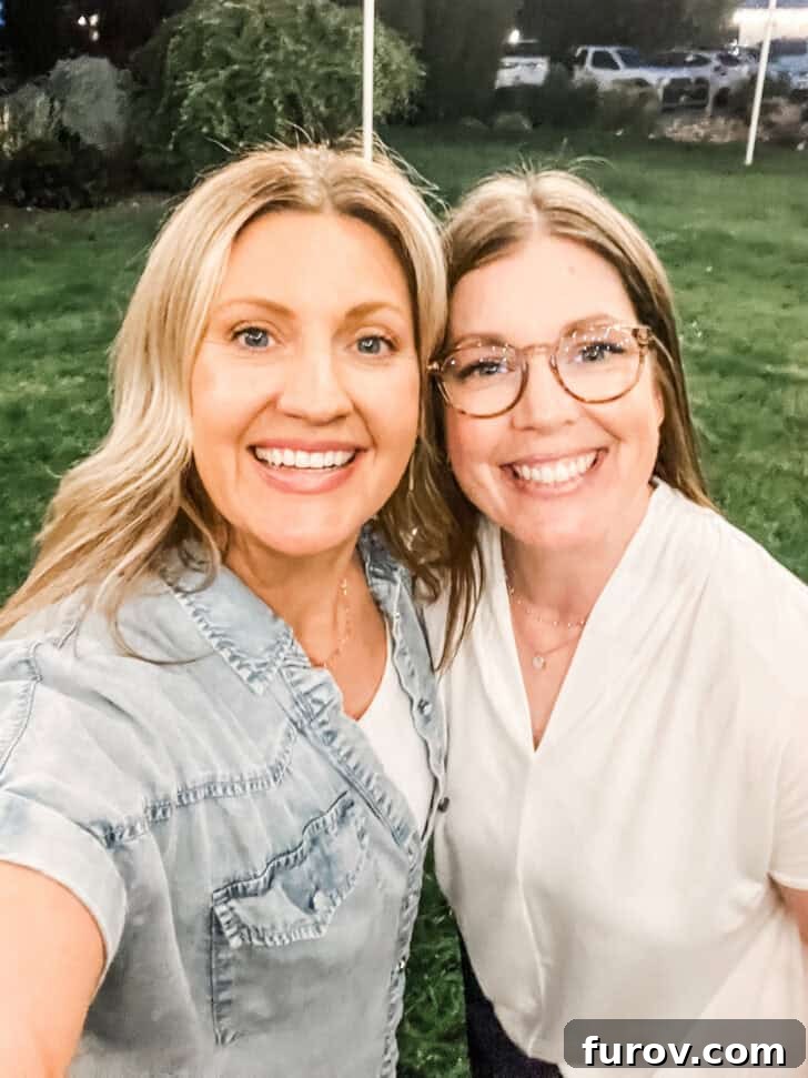 A warm and joyful selfie of friends celebrating at the cookbook launch event.