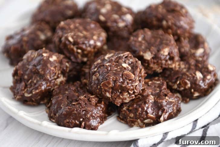 Irresistible No-Bake Chocolate Cookies 10 Stack of rich chocolate no-bake cookies on a white plate, showcasing their perfect, fudgy texture.