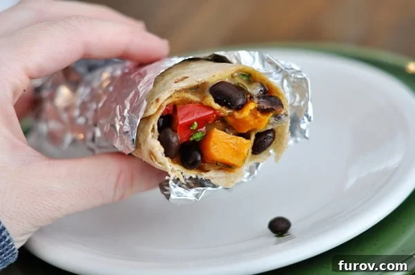 Wholesome Sweet Potato and Black Bean Burritos 3 Inside view of a delicious sweet potato and black bean burrito, showing the vibrant filling.