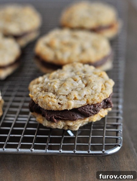 Fudge filled cookies cooling on a wire rack, glistening with their sweet centers.