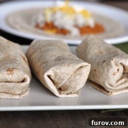 Freezer beef and bean burritos ready to be wrapped.