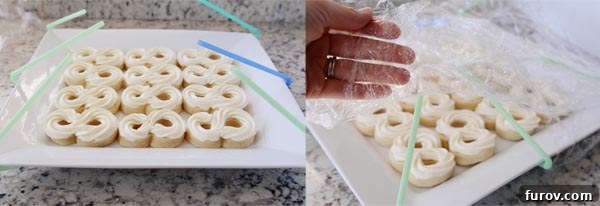 Preserve the Beauty of Your Cupcakes and Cookies During Storage 4 Straws and saran wrap being tented over two white trays of frosted sugar cookies.