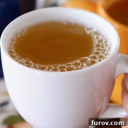 Warm Russian Tea in a white mug, ready to be enjoyed.