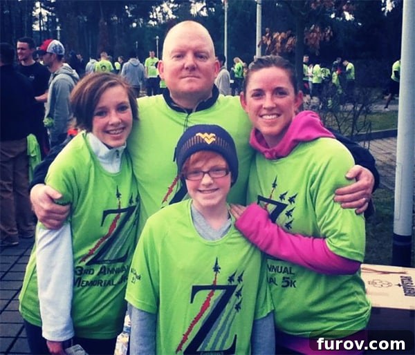 Sarah, empowered and determined, running towards the finish line of her first half marathon.
