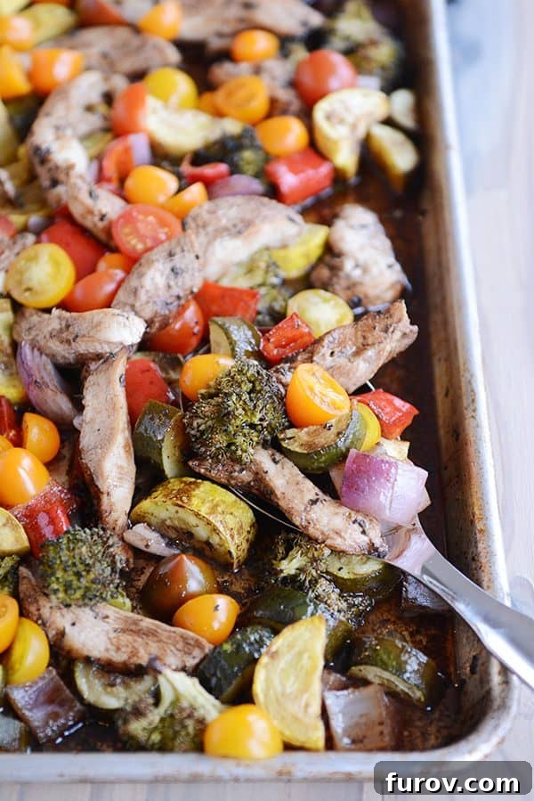 Easy One Pan Balsamic Chicken and Vegetables in 30 Minutes 4 A vibrant sheet pan of balsamic-glazed chicken and cooked vegetables, showcasing the perfect roast and golden-brown edges.