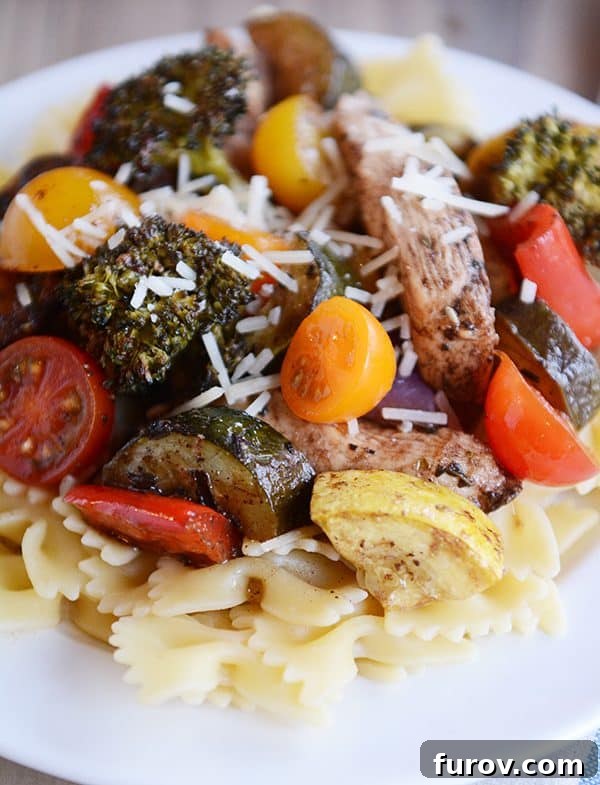 Easy One Pan Balsamic Chicken and Vegetables in 30 Minutes 5 Cooked bowtie pasta artfully arranged and topped with strips of balsamic chicken and perfectly roasted mixed vegetables, garnished with fresh herbs.