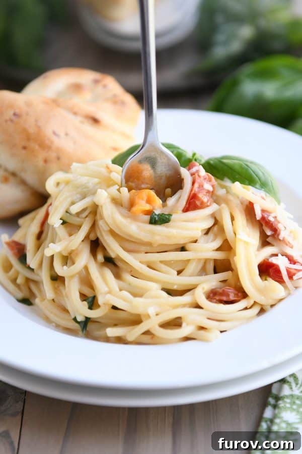 A close-up of the creamy tomato basil pasta, showcasing its rich texture and fresh ingredients.