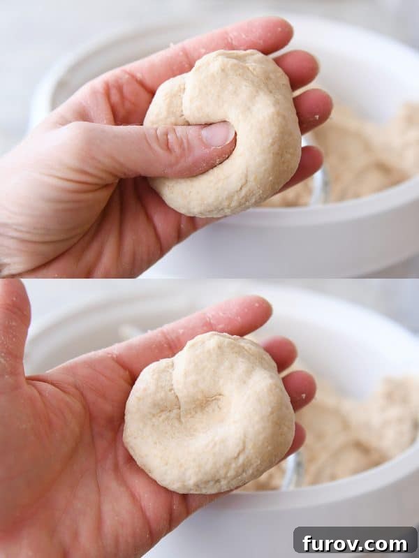 Pressing dimple in piece of bread dough.