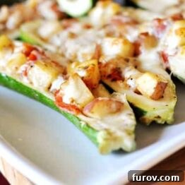 A delicious close-up of The Ultimate Stuffed Zucchini, highlighting its rich filling and golden-brown topping.