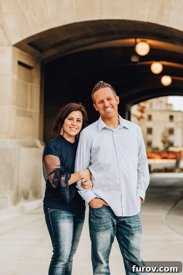 Two people, a man and a woman, standing in front of a tunnel, symbolizing a journey or path forward.