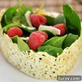 Asiago Crisped Spinach and Raspberry Salad in a cheese bowl