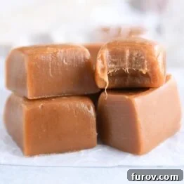 Four gingerbread caramels on white parchment paper, ready to be enjoyed or wrapped.
