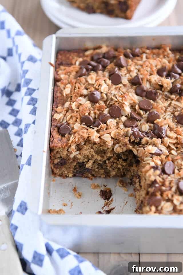 Piece of cake removed from 8X8-inch pan of banana cake.