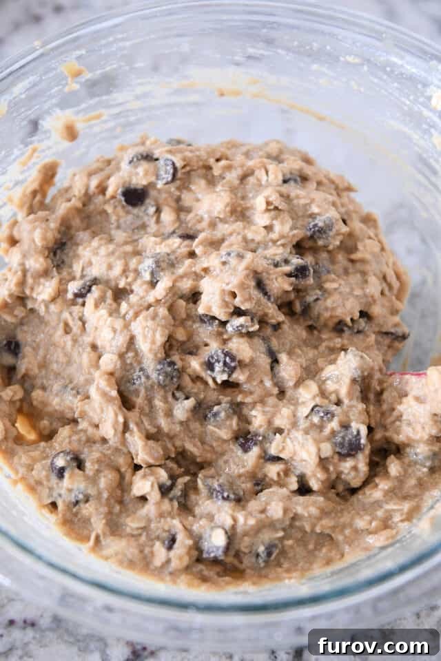 Bowl of banana cake batter with chocolate chips.