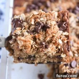 Square piece of banana oat snack cake on spatula.