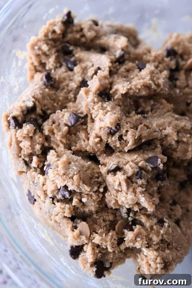Rich chocolate chip oatmeal peanut butter cookie dough, generously studded with chocolate chips, ready for baking.