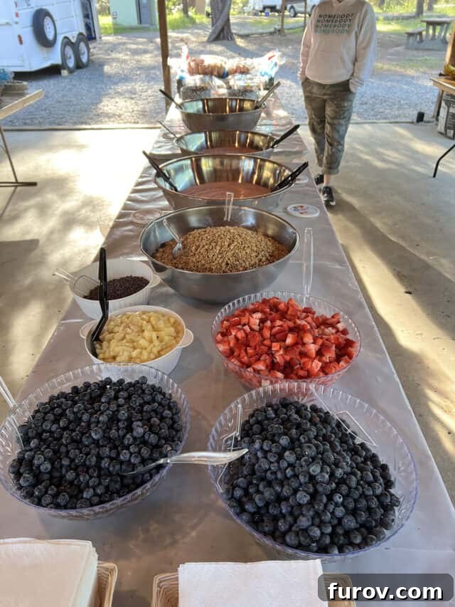 Girls' Camp Food Planning: Menus, Tips and Resources for Large Groups 11 Yogurt parfait ingredients set out on table outside.