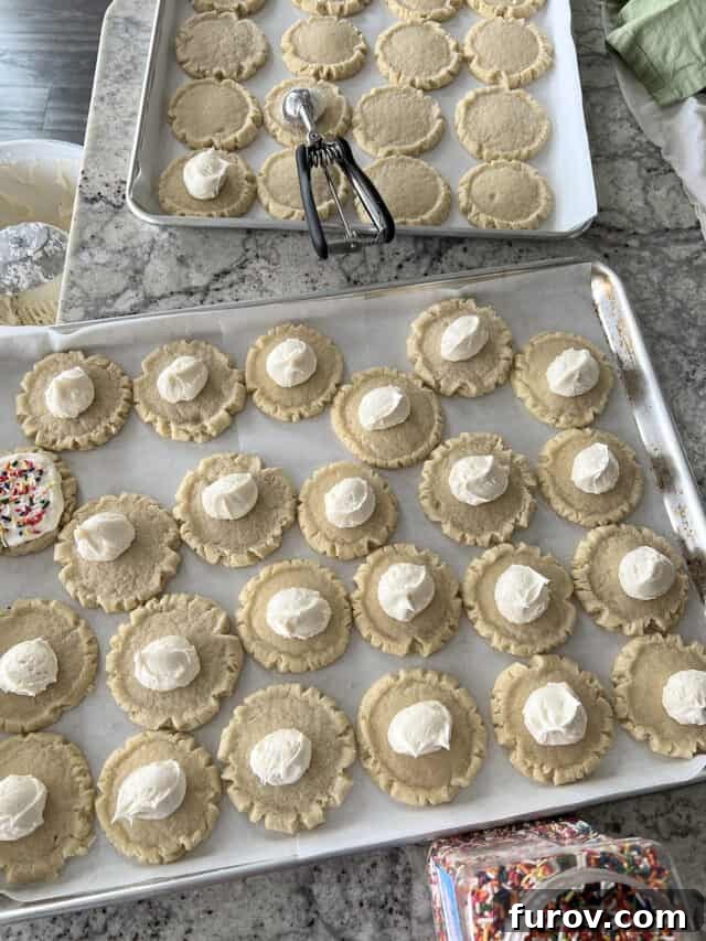 Girls' Camp Food Planning: Menus, Tips and Resources for Large Groups 8 Frosted swig sugar cookies on sheet pan.