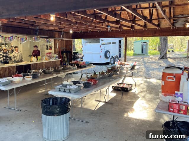 Girls' Camp Food Planning: Menus, Tips and Resources for Large Groups 10 Tables set up outside with food for breakfast.