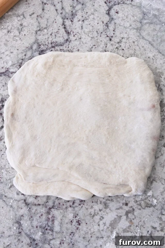 Dough pressed into square.