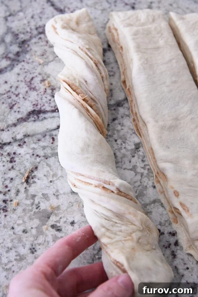 Twisting loaf of cinnamon sugar croissant bread.