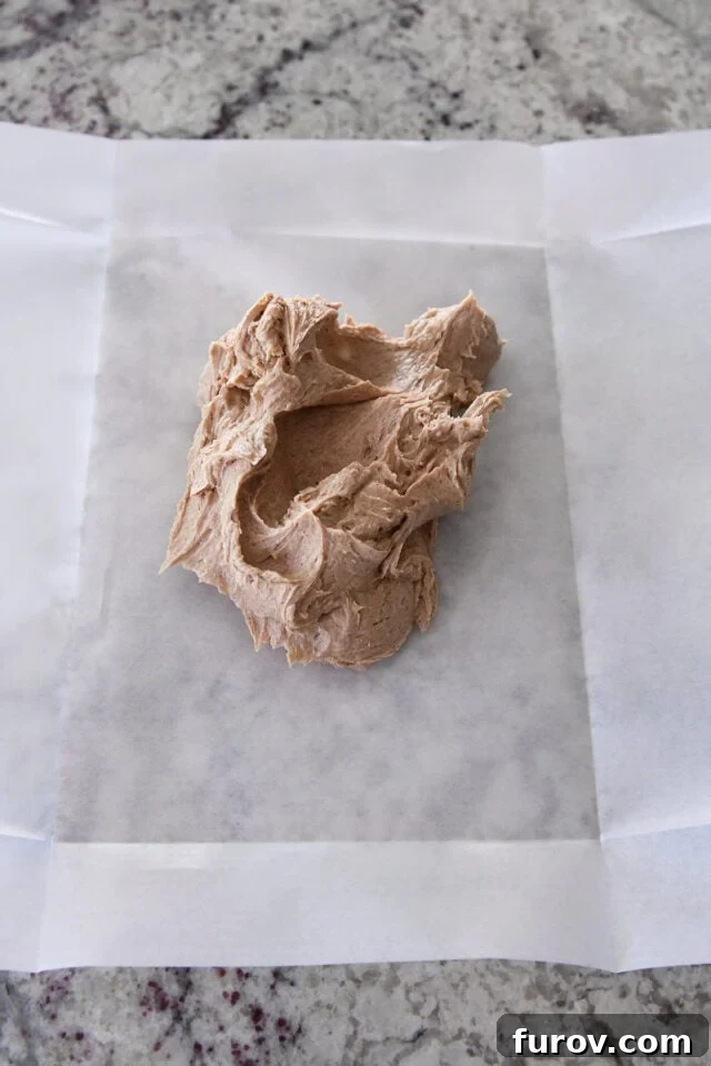 Softened cinnamon sugar butter in center of parchment paper.