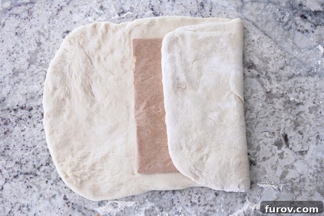 Cinnamon sugar butter packet folded into French bread dough.