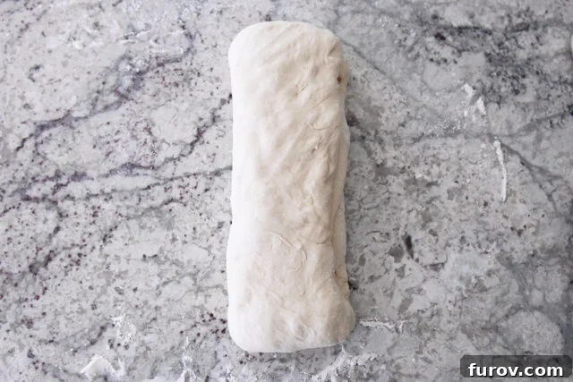 Croissant dough folded in half.