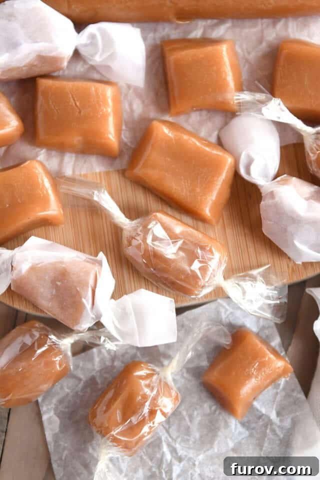 Unwrapped caramels next to wrapped caramels in cellophane and parchment paper.