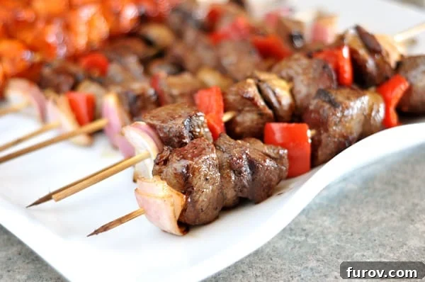 Sizzling Steak and Garden Skewers 2 A vibrant platter of perfectly grilled beef and colorful vegetable kebabs, ready to be served.