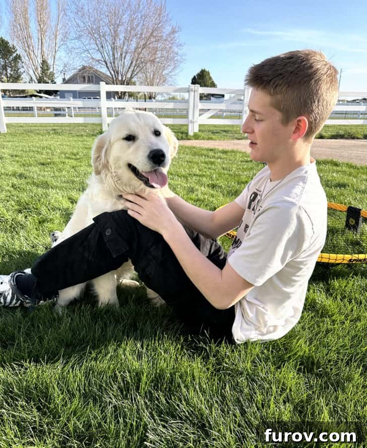Friday Musings and Big Cookbook News 2 A young man with a golden retriever, symbolizing family warmth and companionship.