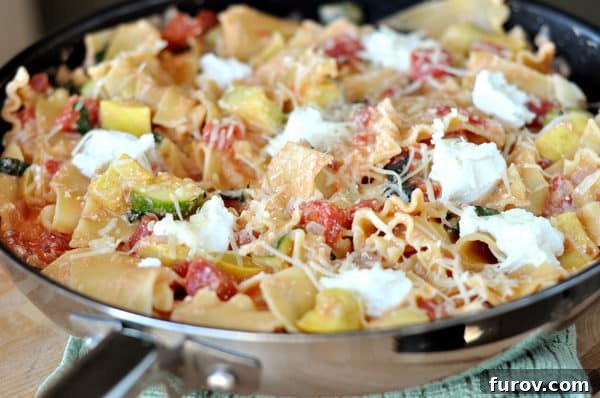 A full skillet of cooked Skillet Summer Vegetable Lasagna, ready to be served.