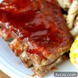 The Best Oven-Baked Ribs, presented beautifully on a platter.