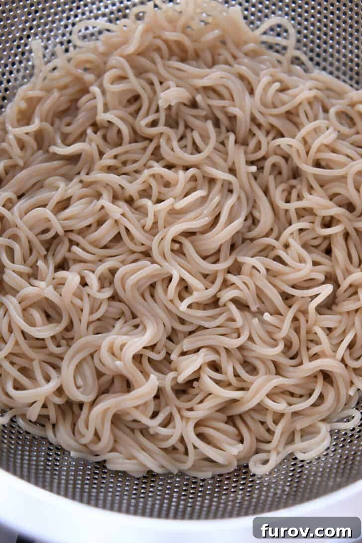 The whisked spicy garlic ramen sauce, showcasing its smooth texture and appetizing color, prepared in a small bowl.
