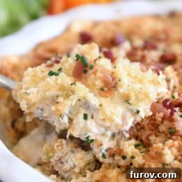 Spoonful of creamy bacon jalapeno popper dip.