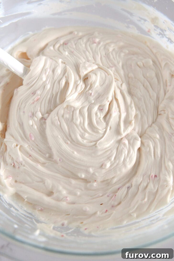 Glass bowl with cream cheese peppermint mixture.