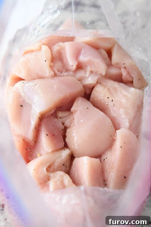 Tangy Honey Glazed Chicken 4 Chicken pieces inside a ziploc bag, seasoned with salt and pepper.