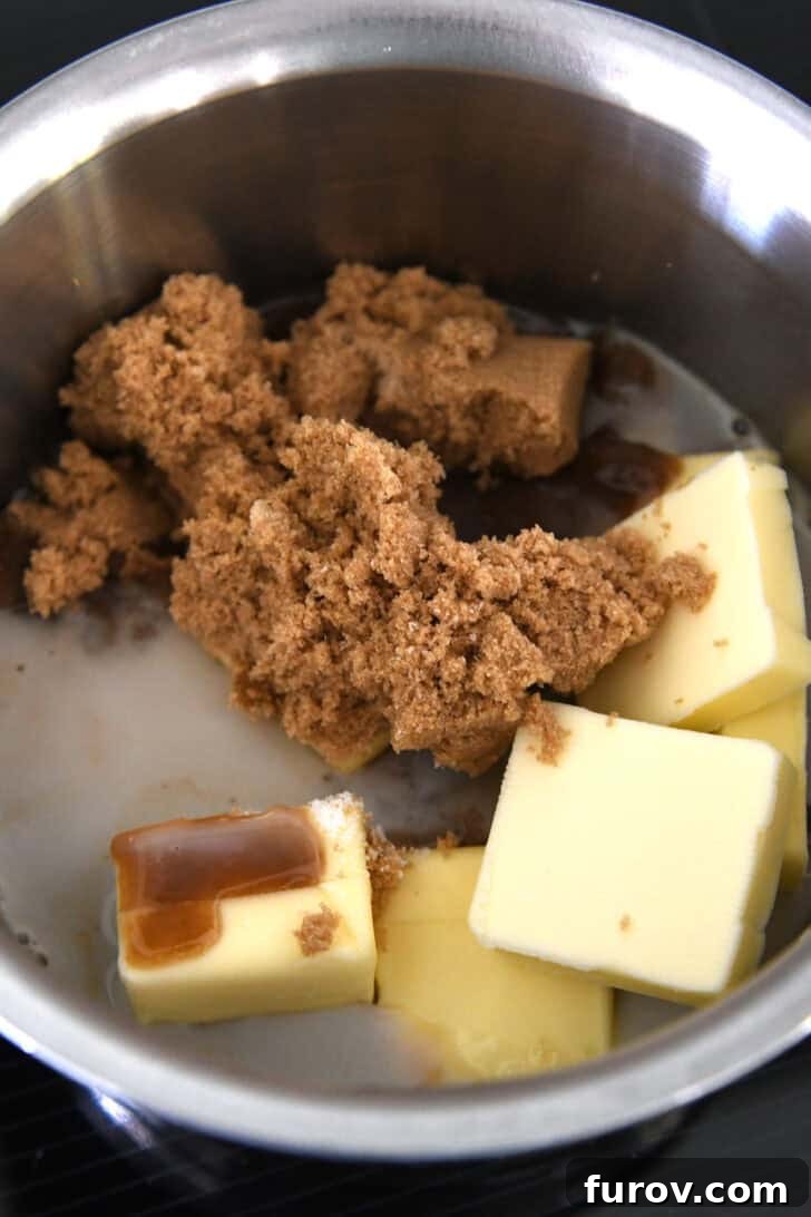 Caramel-Soaked Pumpkin Poke Cake with Whipped Caramel Topping 7 Small saucepan with butter, milk, and brown sugar melting together on the stovetop.