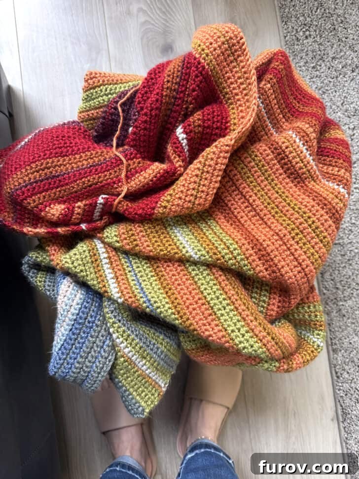 Close-up of a colorful, partially completed temperature blanket