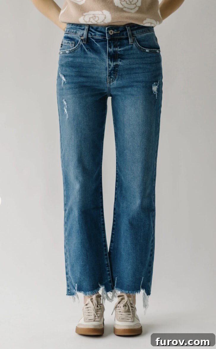Woman modeling stylish wide-leg jeans with a top