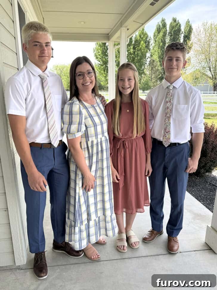 Friday Focus: My Current Chapter 8 A heartwarming photo of a mother and three children posing together on a front porch, full of joy.