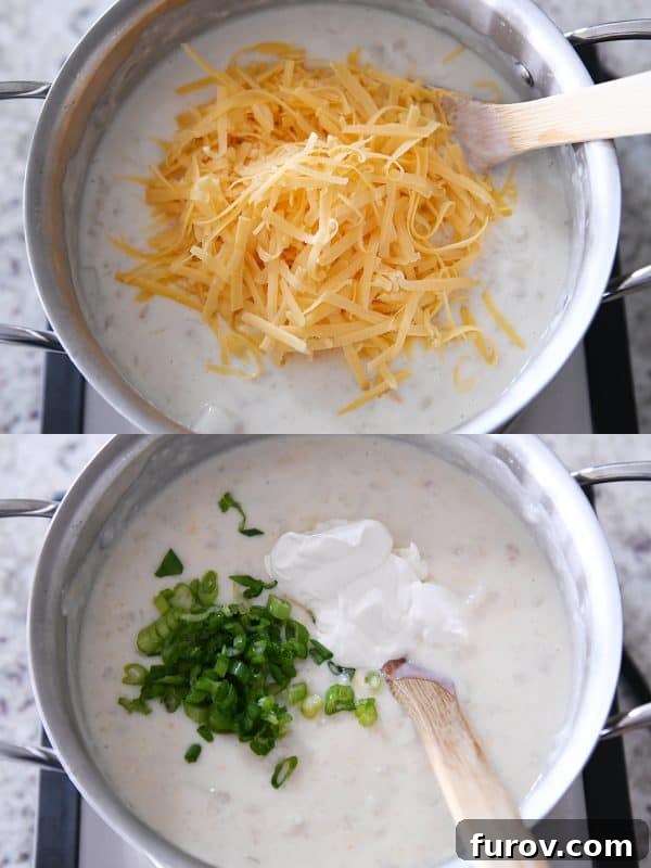 Adding shredded cheddar cheese, green onions and sour cream to loaded baked potato soup.