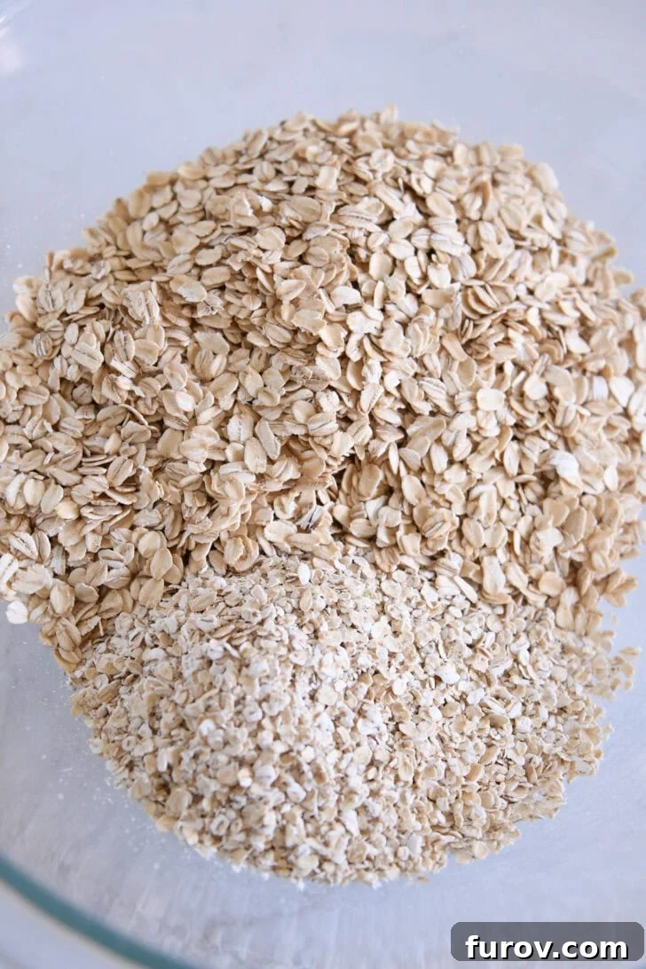 Glass bowl with a mixture of old-fashioned rolled oats and quick oats, ready for the wet ingredients.