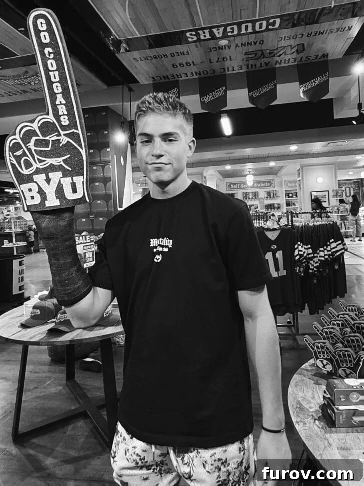 Black and white photo of young man holding foam finger in hand with cast, with text that mentions Mel's Kitchen Cafe Friday Thoughts.