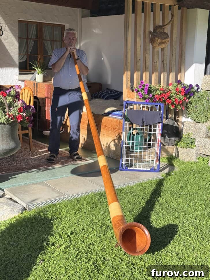 Swiss man playing alpine horn, with text that mentions Mel's Kitchen Cafe Friday Thoughts.