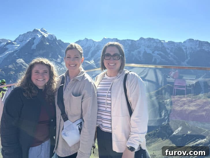 Three women standing at the top of Schilthorn, with text that mentions Mel's Kitchen Cafe Friday Thoughts.