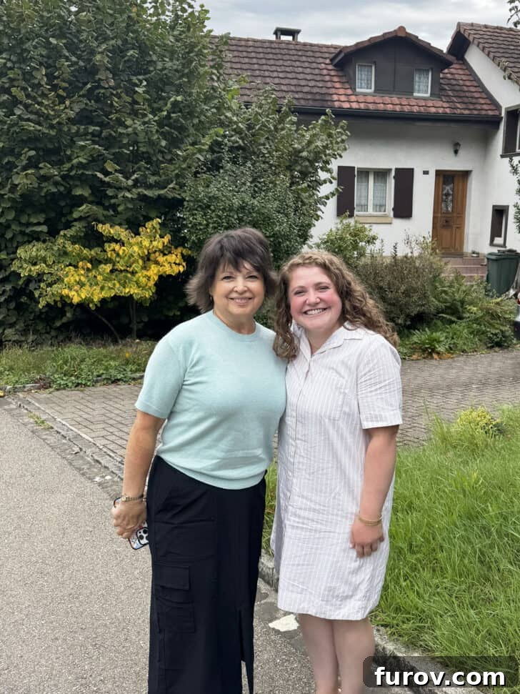 Two women standing in front of Swiss home, with text that mentions Mel's Kitchen Cafe Friday Thoughts.