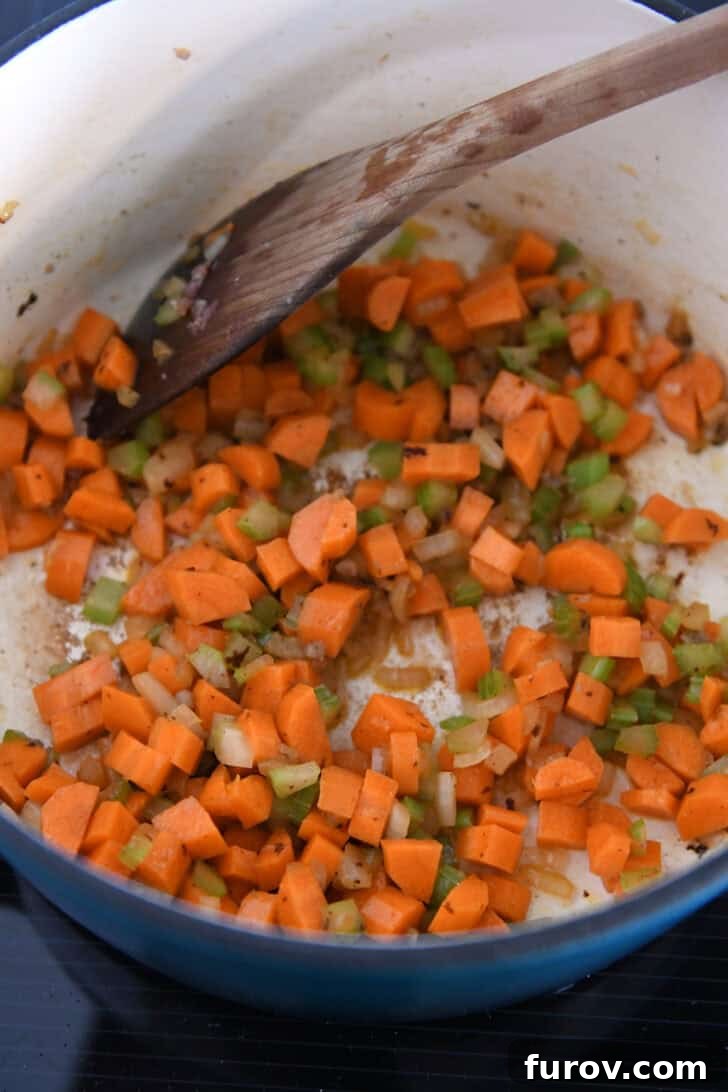 Soup pot with sauteed carrots, onions and celery.