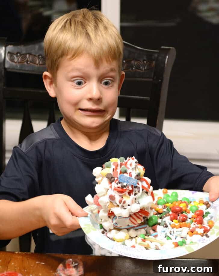 A Friday Medley of Celebrations Questions and Treasures 5 Child enthusiastically decorating a homemade gingerbread house.