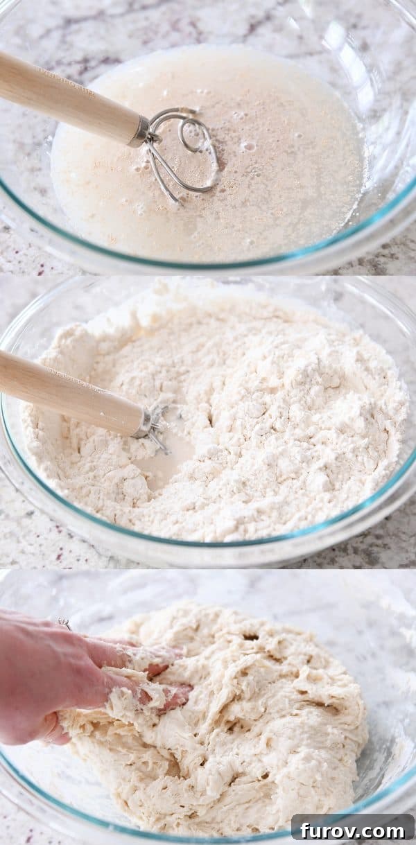 Mixing rustic crusty bread dough in a clear glass bowl, showing the shaggy, sticky texture.